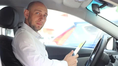 A man sitting in a car Stock Footage 135607334
