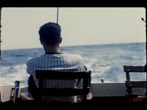 Man Sitting In Chair On Deep Sea Fishing, Stock Video