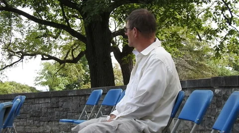 Man sitting on a chair Video stock 55184859