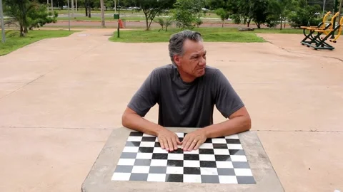 Man Sitting at a Chess Table Stock Footage 168905648