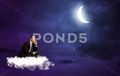 Man sitting on cloud Stock Photos