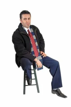 Man sitting in coat. Stock Photos