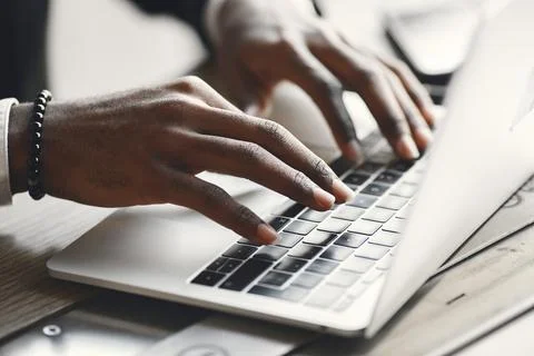 Man sitting at the computer and drinking coffee Stock Photos