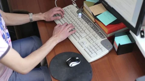 Man sitting at a computer Stock Footage 51859613