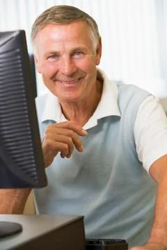 Man sitting at a computer terminal (high key) Stock Photos