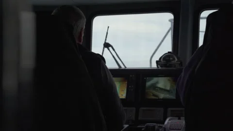 A man sitting at the controls of a small tourist boat Stock Footage 233026085