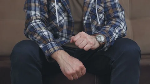 Man sitting on the couch dancing to the music Vídeo Stock 103979403