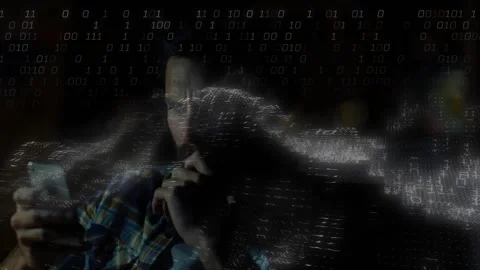 Man sitting on couch reading phone, receiving data and summoning tech binary Stock Footage 330717893