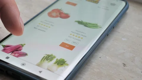 Man Sitting On Couch Using Smartphone Buys In Internet Shop. Male Selects Stock Footage 205281658