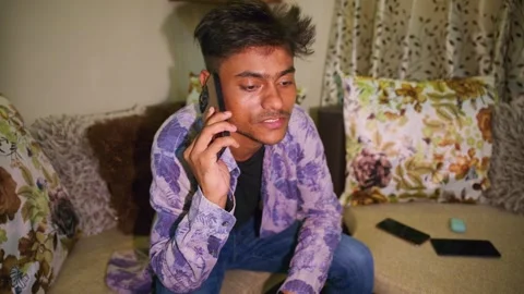 Man Sitting on Couch Using Smartphone Stock Footage 308059640