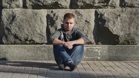 The man sitting by the crowd stream. 4X SLOW MOTION capture Stock Footage 42888958