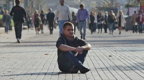 The man sitting by the crowd stream. 4X SLOW MOTION capture Stock Footage 42888975