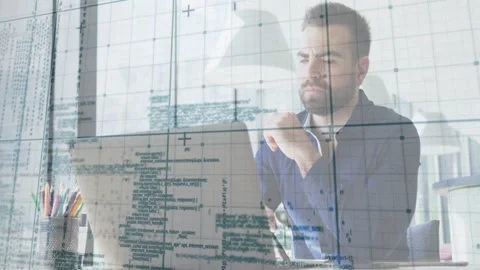 Man sitting at desk rubbing face then leaning forward, typing, debugging tech Stock Footage 333034700