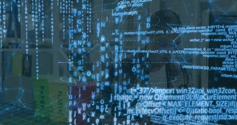 Man sitting at desk in tech watching AR code spirals appearing, rising and Stock Footage 331046173
