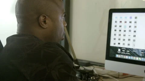 Man Sitting at Desk Working on Desktop Computer Stock Footage 343880481