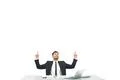The man sitting at the desktop and gesturing on the white background Photo