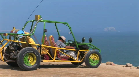  man sitting in dune buggy  Stock Footage 156953