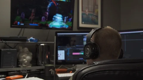  Man Sitting in Editing Suit OS Video stock 92437668