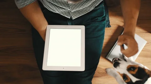 Man sitting on the floor and using tablet pc, top view Stock Footage 54328154