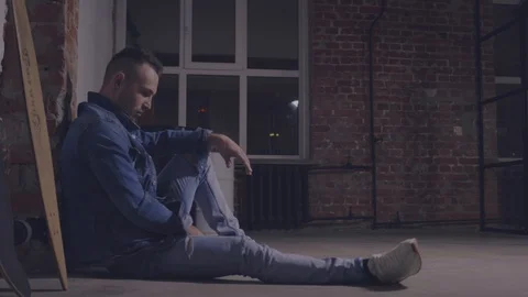 Man sitting on the floor Stock Footage 104398698
