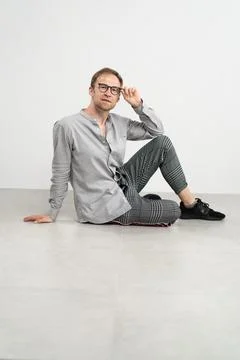 Man sitting on floor Stock Photos