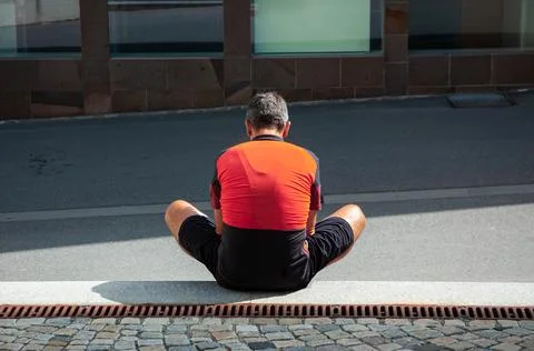 A man sitting on the floor Stock Photos