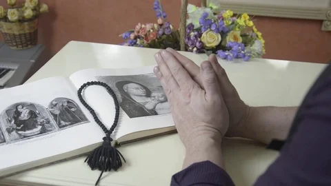 The man is sitting in front of the book Stock Footage 74195362