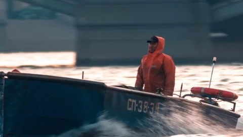 Man Sitting At The Front Of Driving Boat Stock Footage 74454235