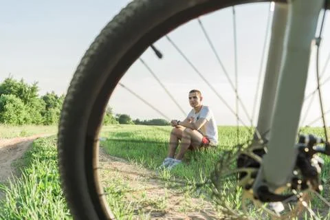 The man sitting on the grass Stock Photos