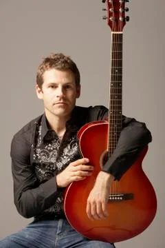 Man Sitting With Guitar Stock Photos