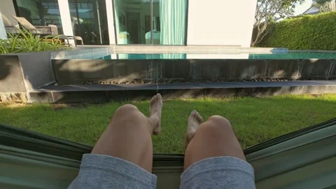 Man sitting in hammock Stock Footage 310683930