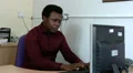 Man sitting at his desk streching his neck HD Footage