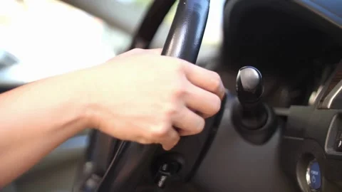 Man sitting inside the car, holding the steering wheel close-up. driver holding Stock-Footage 336266055