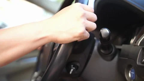 Man sitting inside the car, holding the steering wheel close-up. driver holding Stock-Footage 336266087
