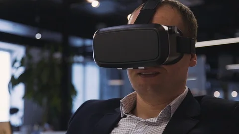 Man sitting inside office in 3d glasses and spending free time w Stock Footage 112422790