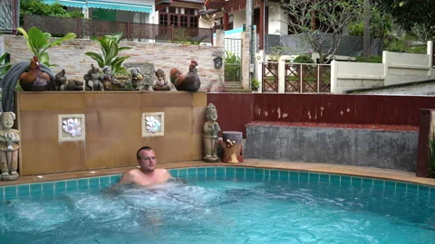 The man sitting in the Jacuzzi Stock Footage 91829278