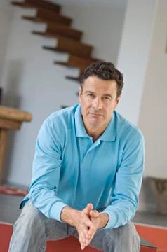Man sitting, joining hands Stock Photos