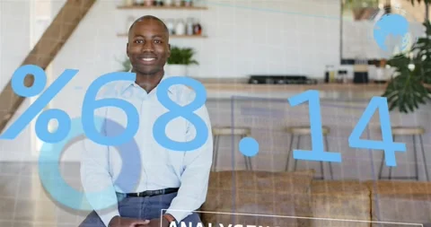 Man sitting in kitchen, data overlay appearing and tech charts growing, checking Stock Footage 320955367