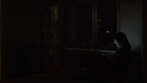 Man sitting on laptop on bed Stock Footage 77385109