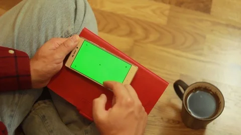 Man sitting looking at the smartphone Stock Footage 91662741