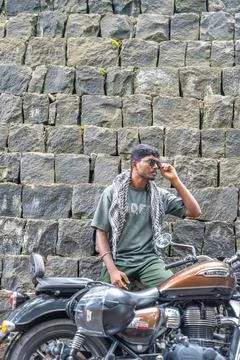 A man is sitting on a motorcycle Stock Photos