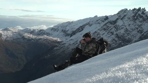 Man sitting on mountain side. Stock Footage 45119105