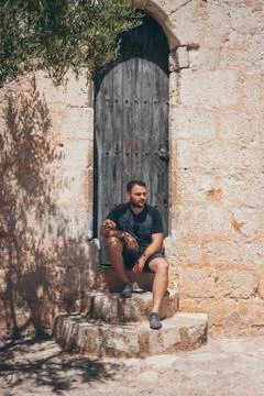 Man sitting o Stock Photos