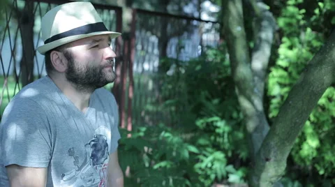 Man sitting outside, young woman comes in and start conversation Stock Footage 59145512