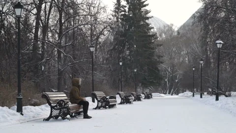Man is sitting in the park Stock Footage 86363531