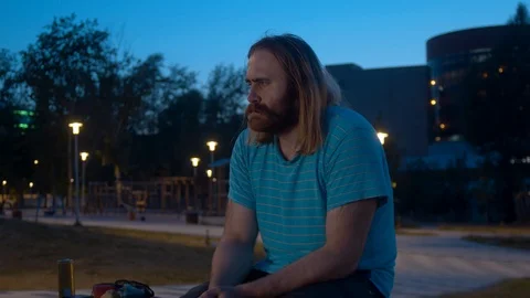 A man sitting in the park Video stock 112750714