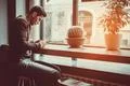 The man sitting with a phone in the cafe Photo