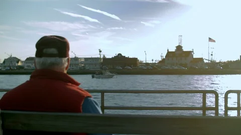 Man Sitting at Pier Stock Footage 128254036