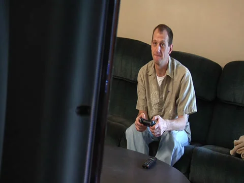 Man Sitting Playing Video Game Видео 37013968