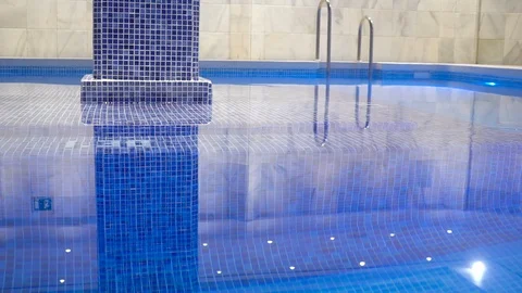 Man sitting in the pool and looking at the camera. Stock Footage 97568274